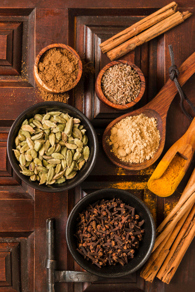 Curated spice bowls on a stone surface