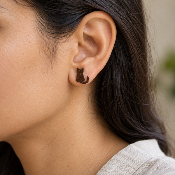 Brown Cat Silhouette Stud Earrings, worn by an adult woman