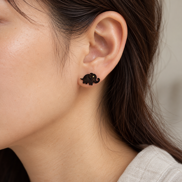 Brown Elephant Silhouette Stud Earrings, worn by an adult woman
