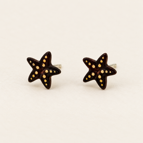 Brown Starfish Stud Earrings with Yellow Details, pair on an ivory studio background
