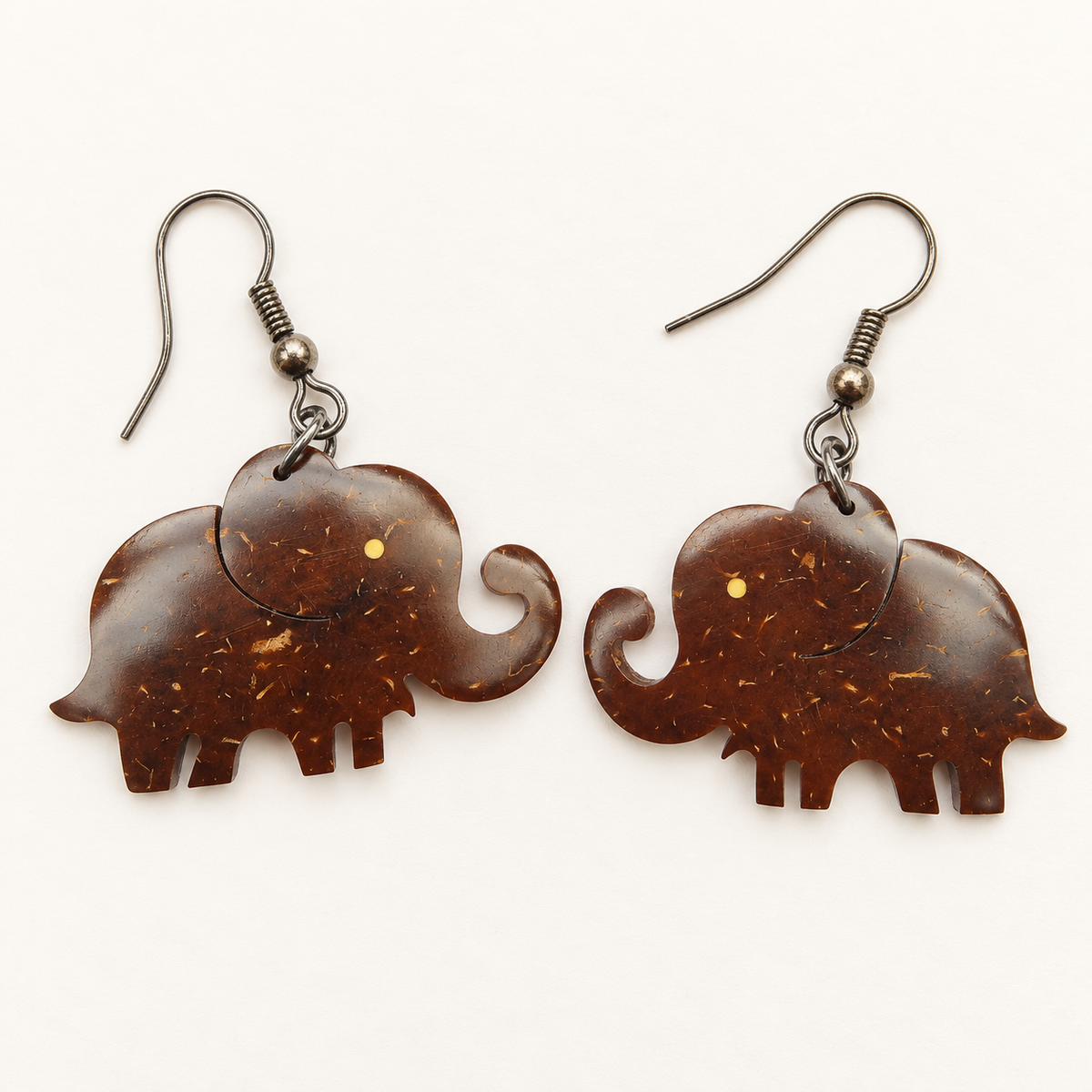 Elephant Coconut Shell Dangle Earrings, studio pair with hook fittings on ivory background