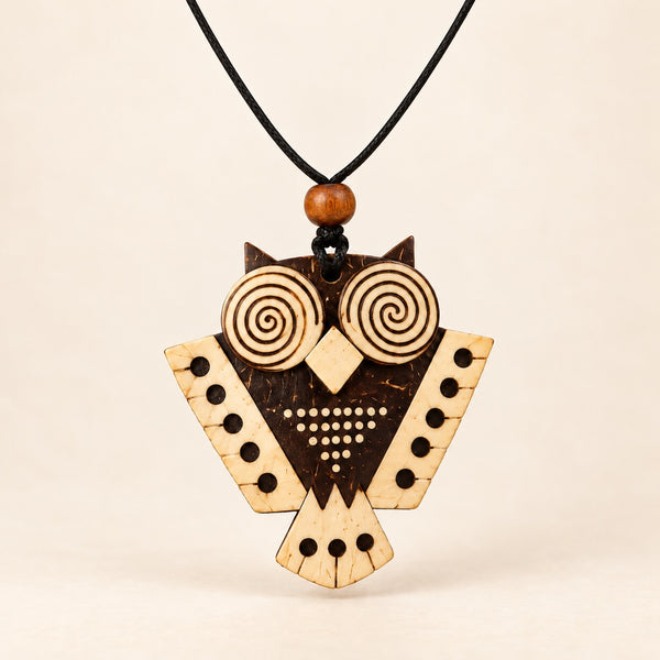 Forest Whisper coconut shell owl pendant necklace on a single black cord, front view