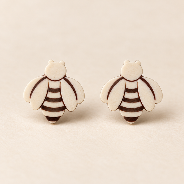 Ivory Bee Stud Earrings, pair on a clean ivory studio background