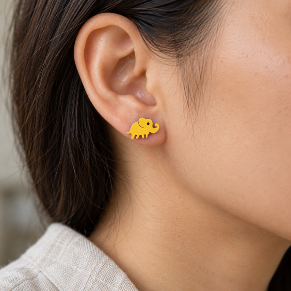 Yellow Elephant Silhouette Stud Earrings, worn by an adult woman